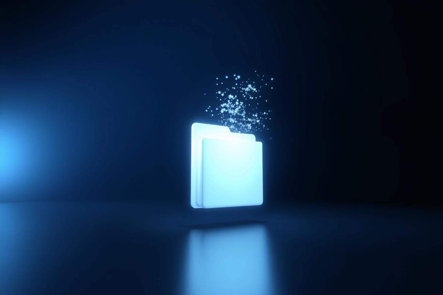 AI generated: A highly stylized 3D render showing a glowing white file folder slowly dissolving into light particles inside a dim, infinite void, lit with soft, cold blue light fading to black,