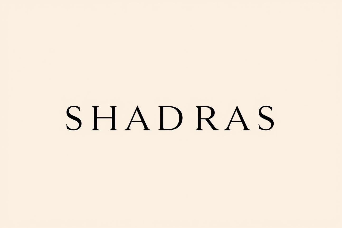 AI generated: Create a premium, minimal, elegant wordmark logo for the brand name “SHADRAS”.
There should be NO circles, NO taste icons, NO symbols around the text.
The logo must be entirely te